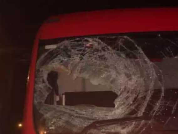 Mindless thugs threw a sandbag off a motorway bridge in Yorkshire - smashing a HGV's windscreen.