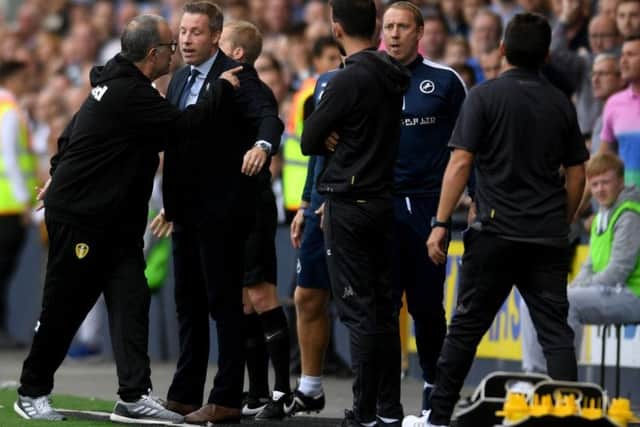 Leeds United head coach Marcelo Bielsa exchanges words with the Millwall bench at The Den on Saturday. Picture: James Hardisty.