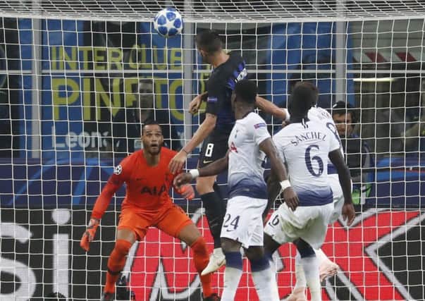 Inter midfielder Matias Vecino, top center, scores his side's second goal during the Champions League, group B soccer match between Inter Milan and Tottenham Hotspur. (AP Photo/Antonio Calanni)