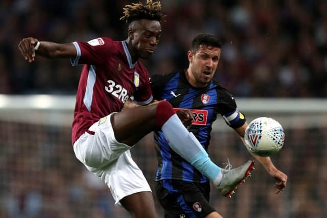 Aston Villa's Tammy Abraham (left) and Rotherham United's Richard Wood battle for the ball (Pictures: PA)
