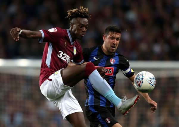 Aston Villa's Tammy Abraham (left) and Rotherham United's Richard Wood battle for the ball (Pictures: PA)