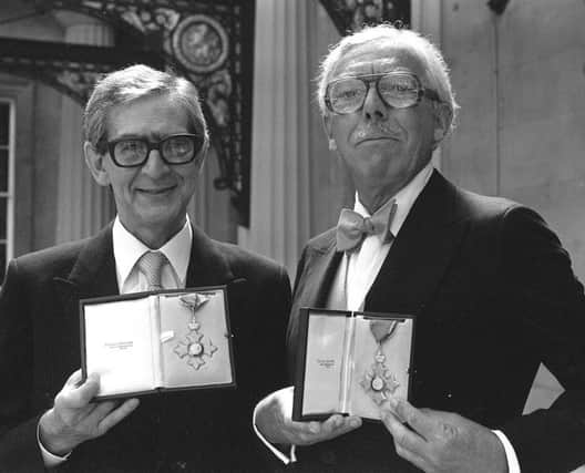 Comedy script writing partners Denis Norden and Frank Muir with their CBEs at Buckingham Palace.