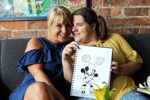 Autistic artist Emy Spinks pictured with her mum Andrea