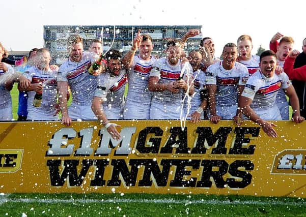 Wakefield celebrate their success of winning the one Million Pound Game against Bradford Bulls in October 2015. Picture: James Hardisty.