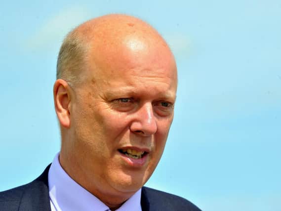 Chris Grayling's Department for Transport was criticised in the inquiry into May's rail timetabling chaos, which caused misery for northern passengers.