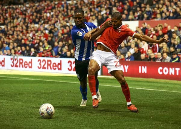 Sheffield Wednesday's Josh Onomah (left) and Nottingham Forest's Saidy Janko battle for the ball.