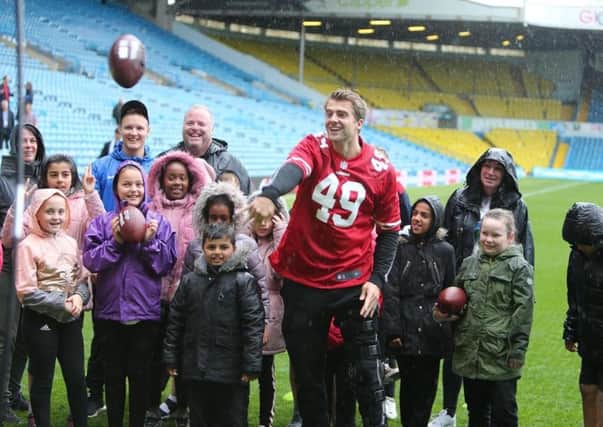 On the grid: Patrick Bamford with pupils from Beeston Primary School in a link-up with Leeds United backers San Francisco 49ers.