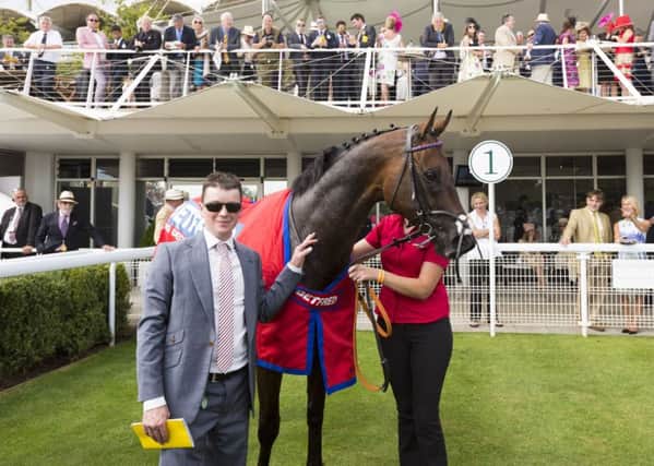 Trainer David Griffiths and Take Cover in the Goodwood winner's enclosure.