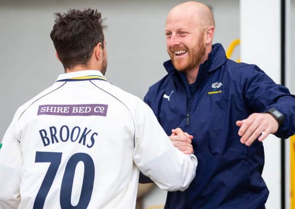 Yorkshire first-team coach Andrew Gale celebrates with Jack Brooks after the win. (Picture: SWPix.com)