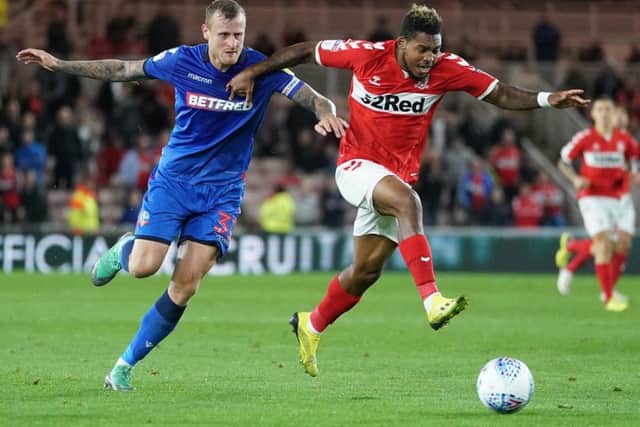 Middlesbrough's Britt Assombalonga (right) and Bolton's David Wheater battle for the ball (Picture: PA)