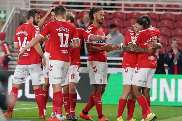 Middlesbrough's Britt Assombalonga (right) is mobbed by team mates after scoring his side's second goal of the game during the Sky Bet Championship match at the Riverside Stadium, Middlesbrough. (Picture: Owen Humphreys/PA Wire)