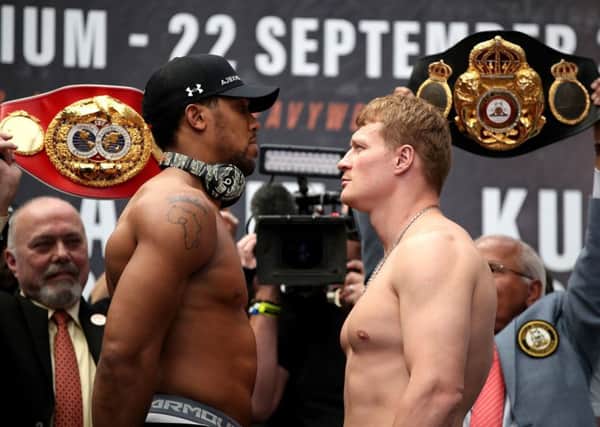 Anthony Joshua and Alexander Povetkin during the press conference at the Business Design Centre, London. Picture: Nick Potts/PA Wire