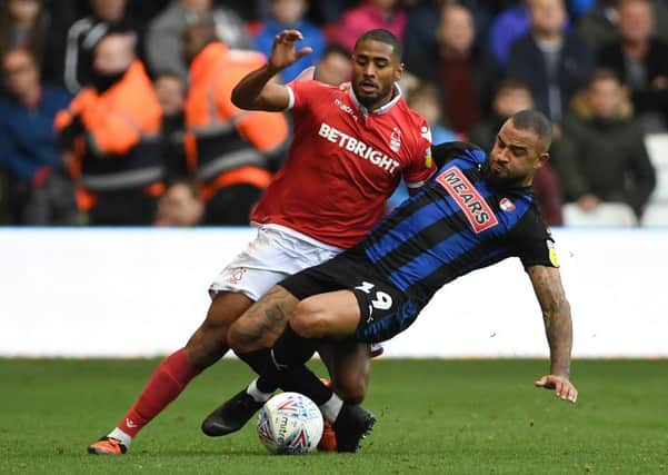 Tackle: Nottingham Forest's Saidy Janko is challenged by Rotherham United's Kyle Vassell.