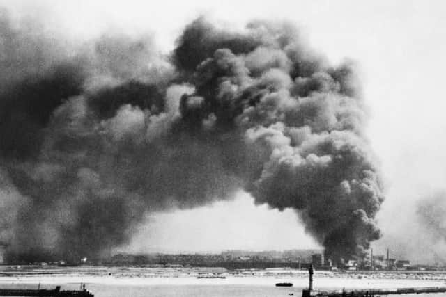 Ships holding position off the beaches at Dunkirk and smoke billowing from burning oil storage tanks, deliberately ignited by the fleeing Allies in order to prevent such a useful resource falling into the hands of the invading Germans, which features in the book The War on Paper: 20 Documents That Defined the Second World War. Photo: IWM/PA Wire