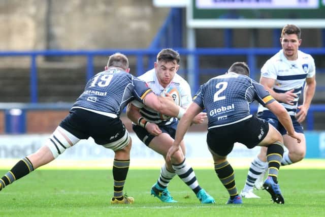 TOUGH DAY: Yorkshire Carnegie's 
Dylan Donnellan runs into Nottingham's Shane Buckley and Luke Cole. Picture: Steve Riding.
