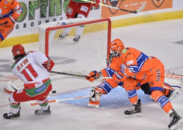 BAD START: Jiri Gula tries to stop Stephen Dixon putting cardiff Devils ahead at Sheffield Arena on Sunday night. Picture: Dean Woolley.