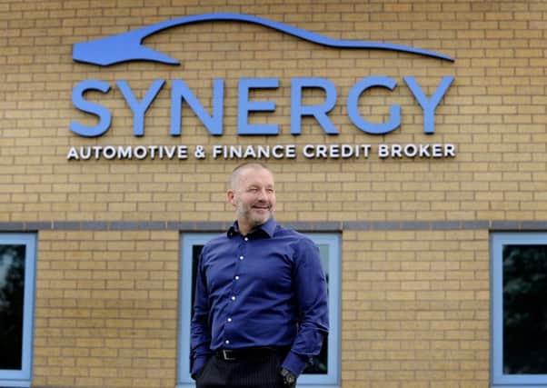 All smiles: Paul Parkinson, managing director of Synergy, is pleased with the firms NPS score. Pic: Simon Hulme