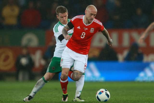 David Cotterill (right) in action for Wales against Northern Ireland's Steven Davis in March 2016. Picture: David Davies/PA