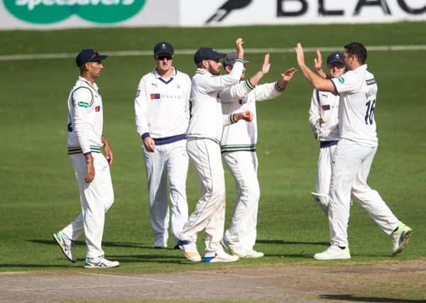 Tim Bresnan, right, is congratulated by Yorkshire team-mates after having Worcestershire opener Tom Fell caught by Jack Leaning. It was the first of the wickets that saw Yorkshire claim two bowling points at New Road to ensure their Division One survival (Picture: John Heald).