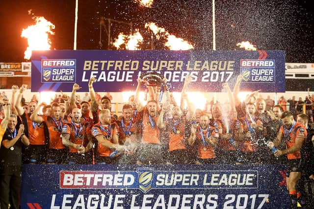 Ecstatic Castleford Tigers, above, lift the League Leaders Shield last year - in stark contrast to St Helens this time around. (Alex Whitehead/SWpix.com)