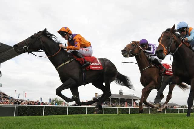 Harbour Law and George Baker (left) win the St Leger in September 2016.