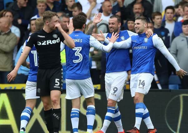Derby triumph: Sheffield Wednesday's Gary , second right, celebrates scoring his side's first goal against Leeds United at Hillsborough last season.