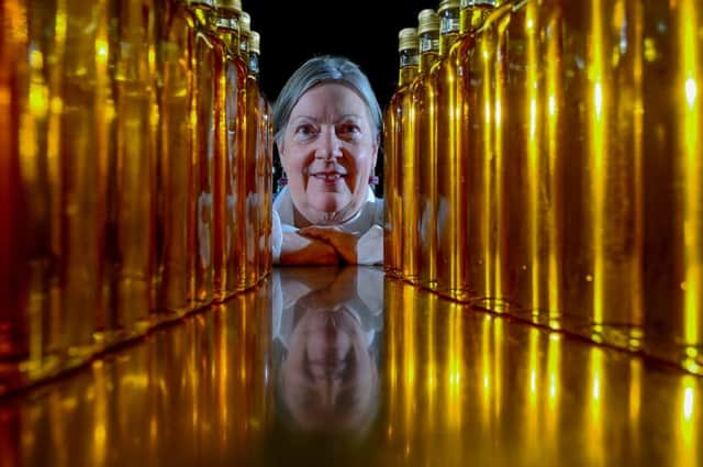 The  managing director of Wharfe Valley Farms, Sallyann Kilby, with some of their bottled Rapeseed Oil. Picture James Hardisty