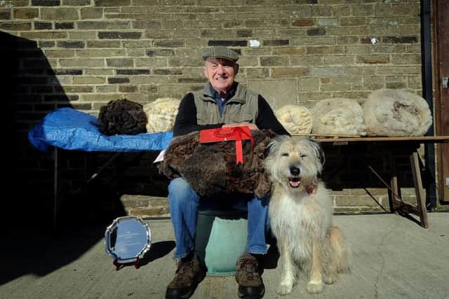 Peter Conwell with his dog Alfie on his farm at Bradshaw, Halifax.