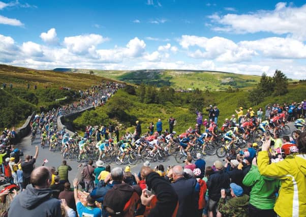 The peloton makes it's way up Grinton Moor on day 1 of Le Tour de France, just as it will do against next year's 2019 UCI World Championships in Yorkshire. (Picture: Shaun Flannery/SWPix.com)