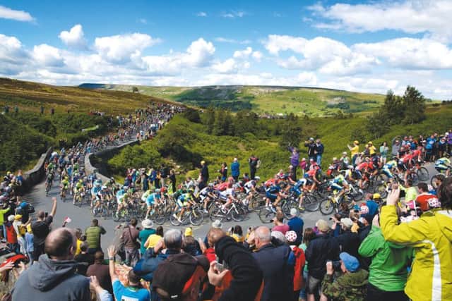 The peloton makes it's way up Grinton Moor on day 1 of Le Tour de France, just as it will do against next year's 2019 UCI World Championships in Yorkshire. (Picture: Shaun Flannery/SWPix.com)
