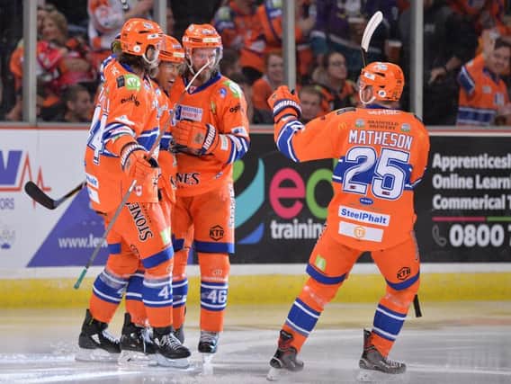 HITTING BACK: Sheffield Steelers' players celebrate with goal-scorer Jordan Owens after he halved the deficit against the Dundee Stars early in the third period.
Picture: Dean Woolley.