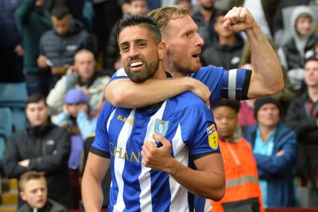 Former Leeds United central defender Tom Lees, right, congratulating Marco Matias on his goal  for Sheffield Wednesday against Aston Villa, is relishing tonights encounter at Hillsborough (Picture: Steve Ellis).