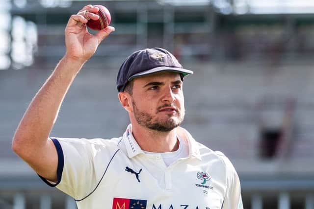 On his way: Yorkshire's Jack Brooks celebrates his five wicket haul..