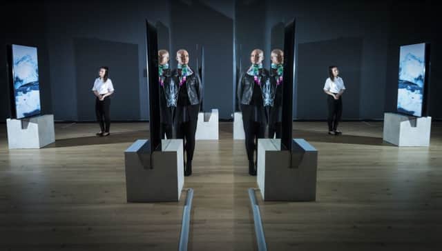 Lauran Masterman (left) and Vanessa Myrie (centre) are reflected in mirrors that form part of an art installation at York Mediale.