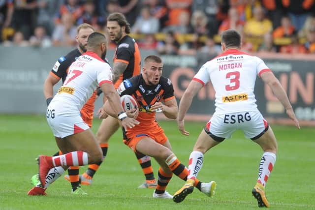 Castleford Tigers' Greg Minikin seen in action against St Helens' Dominiqie Peyroux and Ryan Morgan in the Challenge Cup earlier this season (Picture: Tony Johnson).