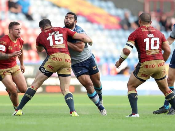 Huddersfield Giants' Sebastine Ikahihifo in action with Catalans Dragons' Mickael Simon in this season's Challenge Cup meeting between the two sides. Picture: SWPix.com