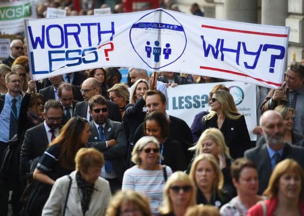 Headteachers from across England and Wales march towards Downing Street in London to demand extra cash for schools. PRESS ASSOCIATION Photo. Picture date: Friday September 28, 2018. See PA story EDUCATION Headteachers. Photo credit should read: Kirsty O'Connor/PA Wire