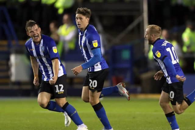 Sheffield Wednesday's Adam Reach (centre) celebrates scoring his side's goal with team-mates at Hillsborough. Picture: Richard Sellers/PA