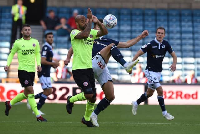 David McGoldrick of Sheffield United is challenged by Ryan Leonard of Millwall . Picture: Robin Parker/Sportimage