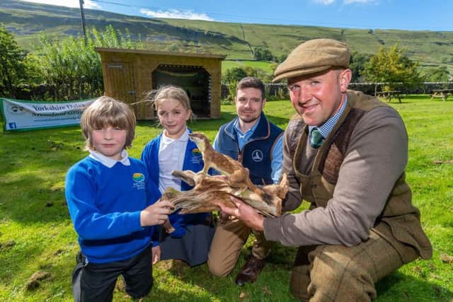 A group of pupils at Kettlewell Primary School in Upper Wharfedale, North Yorkshire, were for the first time having a lesson in their new outdoor Ã¢Â¬Ãœforest classroomÃ¢Â¬". Funds raised by the Yorkshire Dales Moorland Group (YDMG) and partners have enabled the construction of an outdoor learning facility which will benefit four schools across the Dales as well as local scouts and brownie groups. Pictured Pupils Jake White, and arabella Thornton, with Colin Chalkley, owner of Dog & Field, and Ian Sleightholm, Gamekeeper at Bolton Castle Estate, looking at stoat.