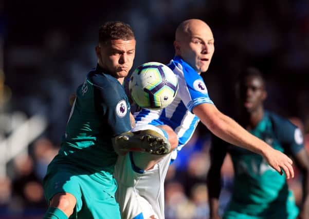 Battle: Huddersfield Town's Aaron Mooy and Tottenham Hotspur's Kieran Trippier challenge for the ball.