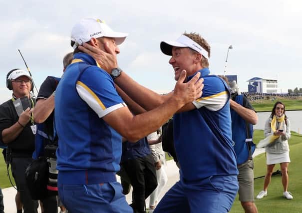 Team Europe's Sergio Garcia and Ian Poulter celebrate winning the Ryder Cup. Picture: David Davies/PA