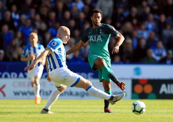 Huddersfield Town's Aaron Mooy (left) and Tottenham Hotspur's Mousa Dembele battle for the ball. Picture: Mike Egerton/PA