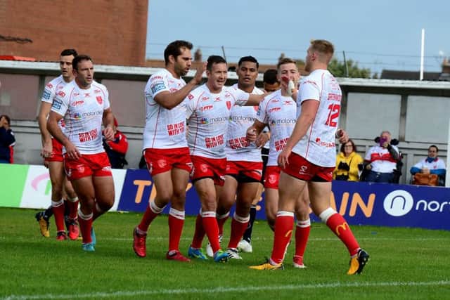 James Greenwood, of Hull Kingston Rovers, celebrates after scoring the first try of the match.