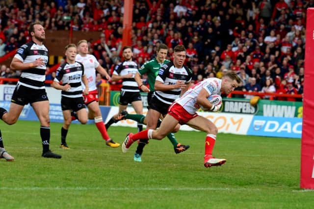Chris Atkin, of Hull Kingston Rovers, races in to score a try.