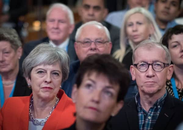 Prime Minister Theresa May and her husband Philip listen to Conservative party chairman Brandon Lewis open the Conservative Party annual conference at the International Convention Centre, Birmingham.