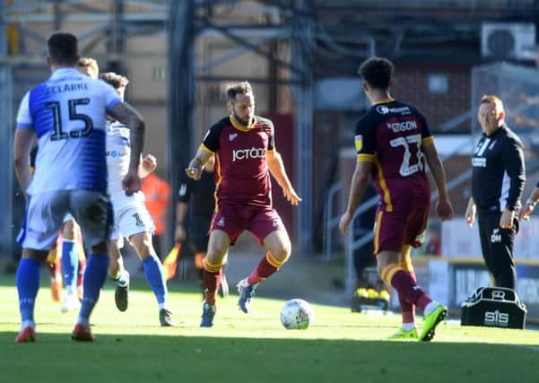 On the ball: Jim O'Brien making the most of new deal with Bradford City and in action against Bristol Rovers. Picture: James Hardisty