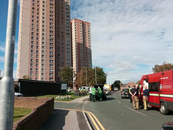 Firefighters and other emergency services at the scene of the Cottingley Towers fire
