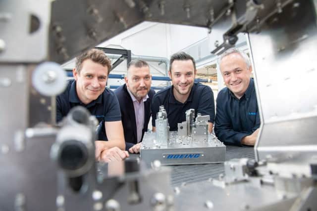 The team from MetLase has secured a major contract win. (l-r) Sam Simpson (Principal Engineer), Steve Dunn (Managing Director), James Needham (Senior Operations Manager at Boeing Sheffield) and Richard Gould (Sales Manager)
