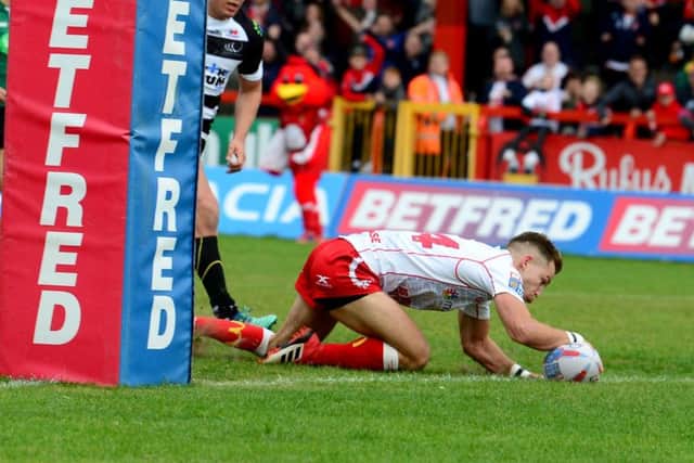 Pictured Chris Atkin, of Hull Kingston Rovers, scoring a try as Widnes were beaten and Rovers survived (Picture: James Hardisty)